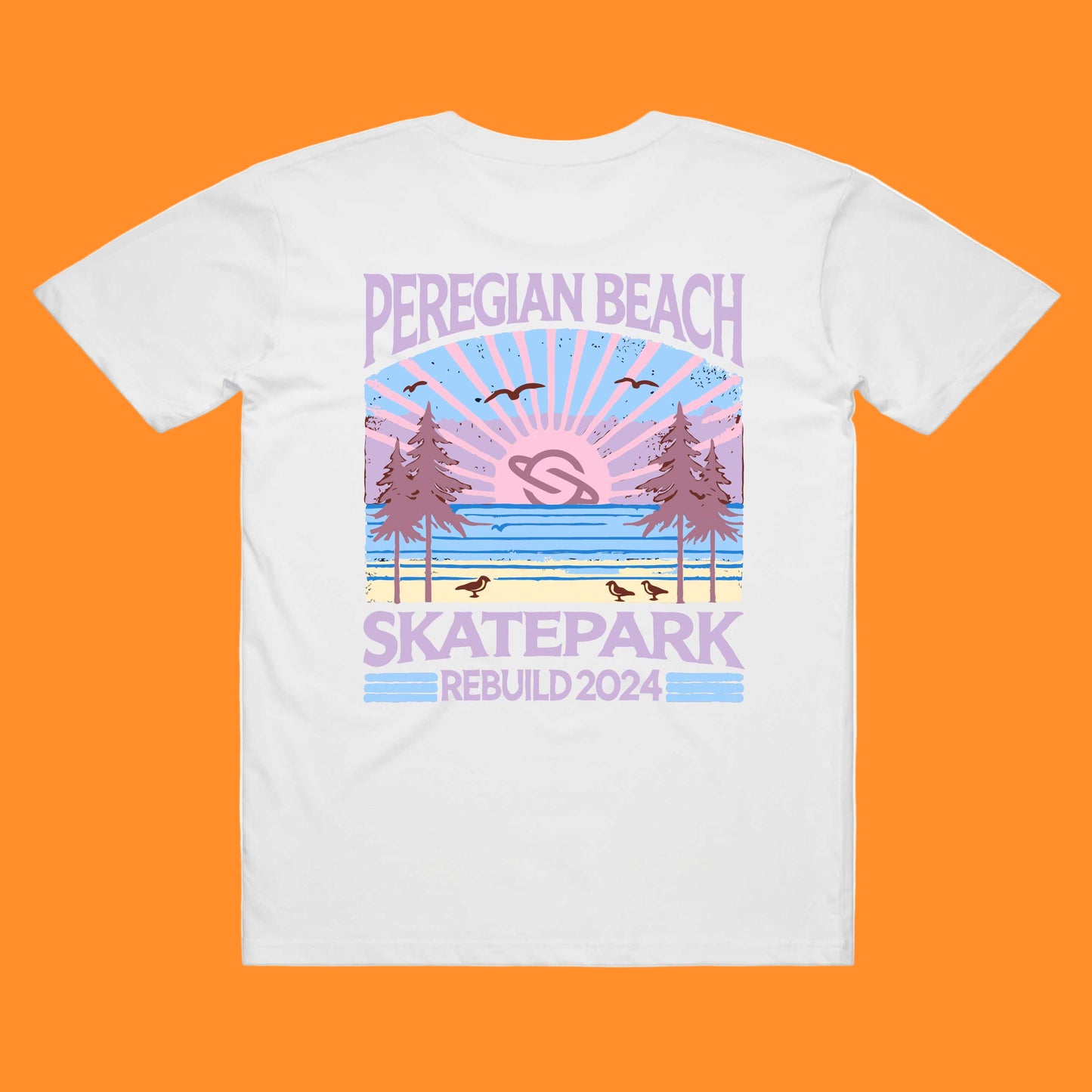 A white t-shirt with a printed design featuring the text 'PEREGIAN BEACH SKATEPARK' and a graphic of a sunset over a skatepark with birds and trees.