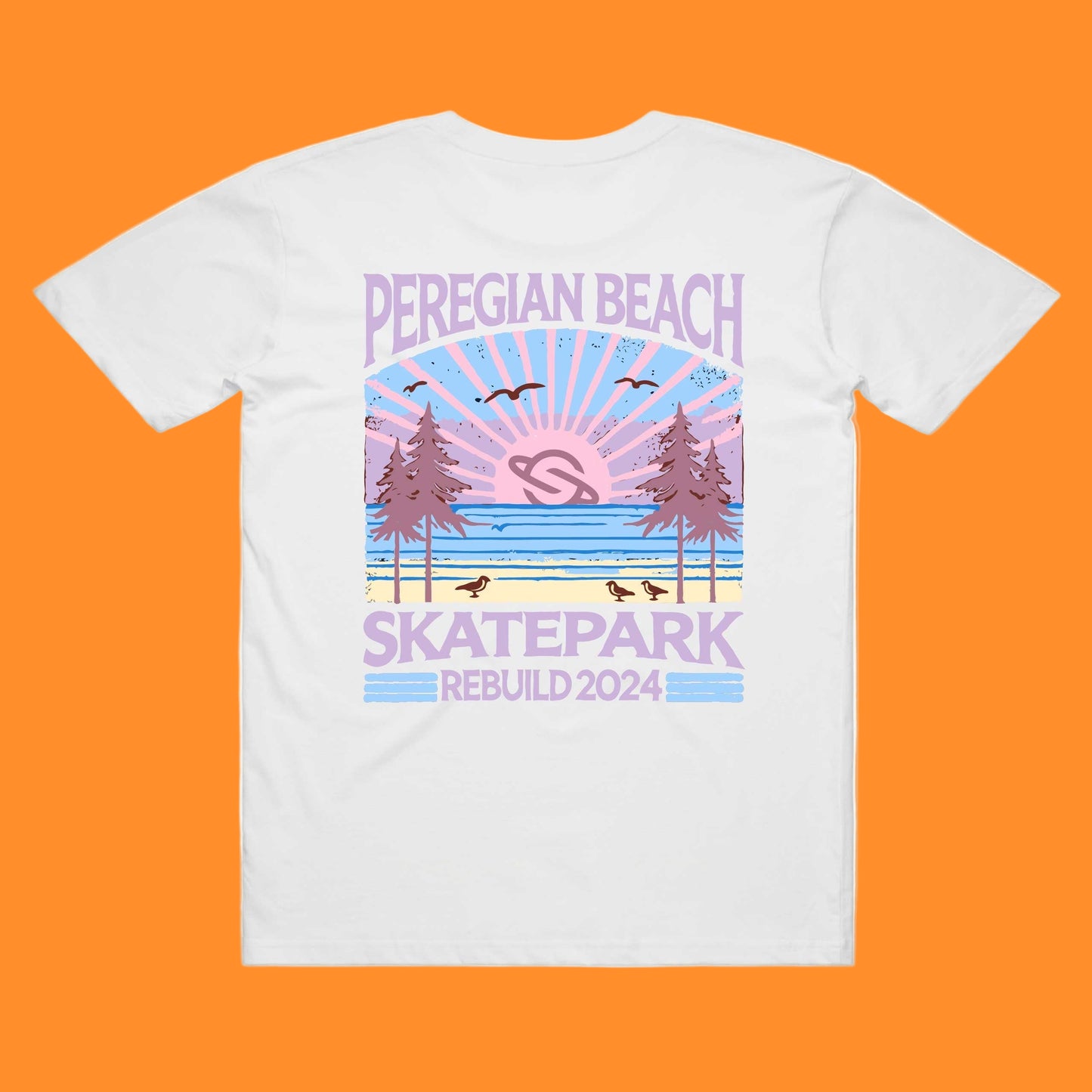 A white t-shirt with a printed design featuring the text 'PEREGIAN BEACH SKATEPARK' and a graphic of a sunset over a skatepark with birds and trees.
